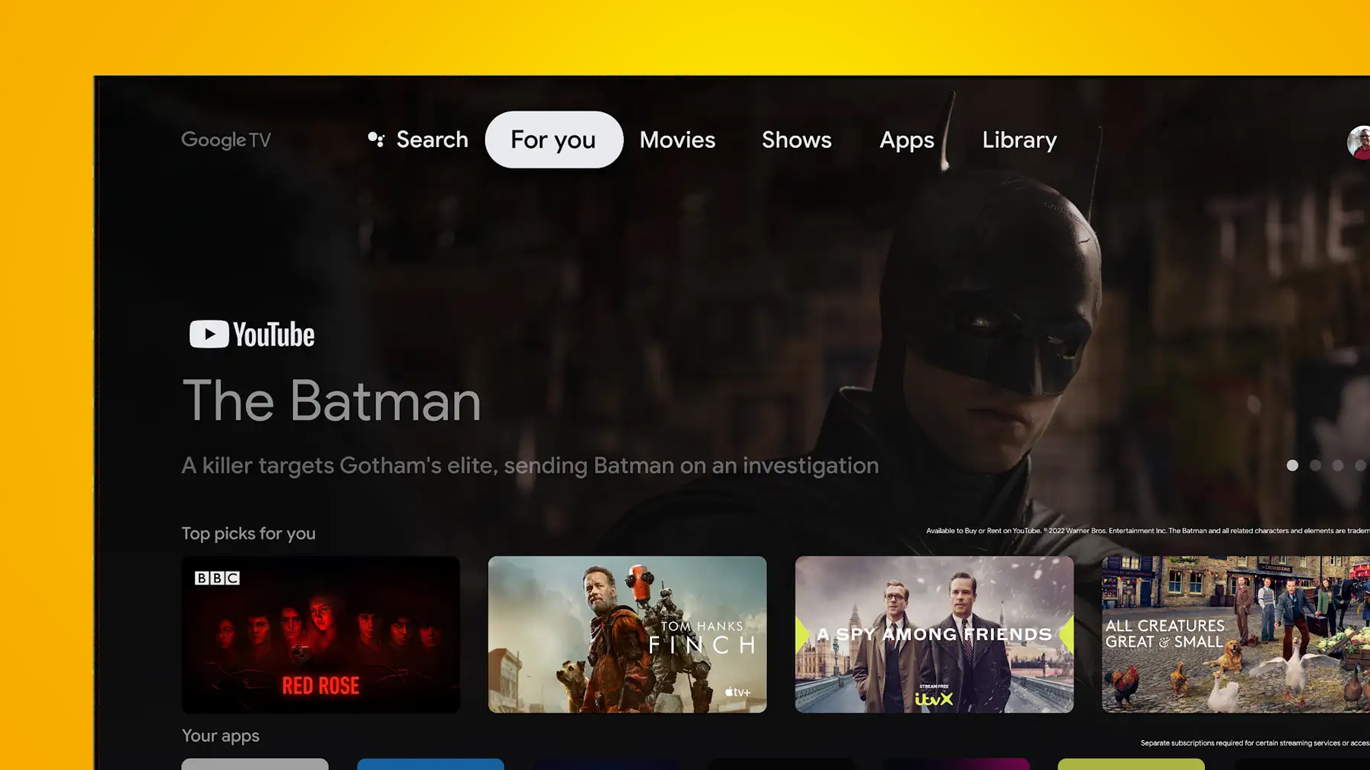 A TV on an orange background showing the Google TV interface