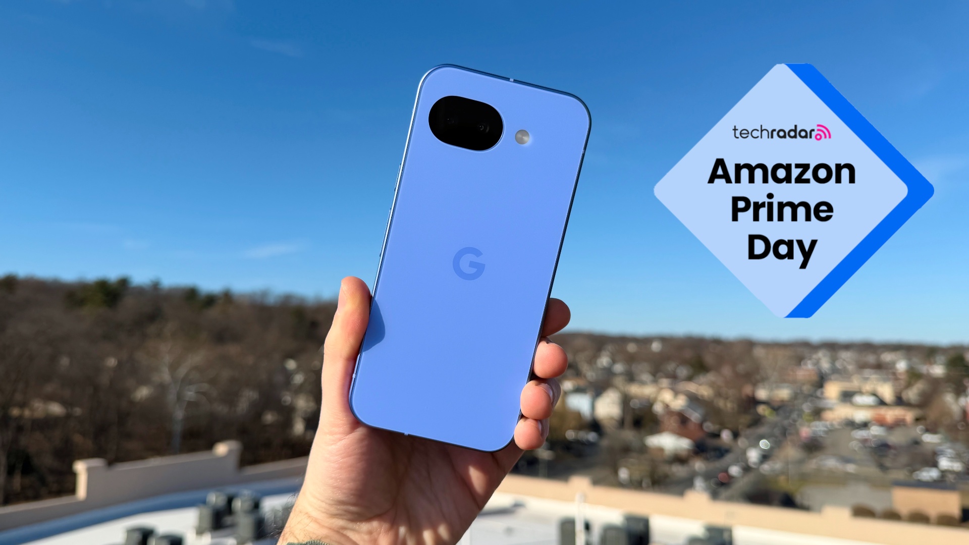 Person holding the Google Pixel 10a with a badge that reads 'TechRadar: Amazon Prime Day'