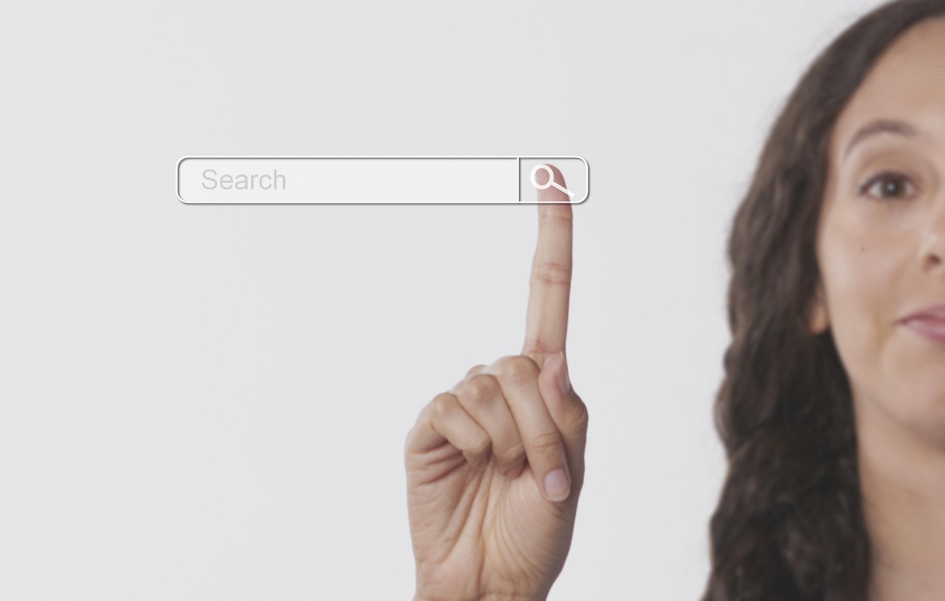 Person pointing at a search bar