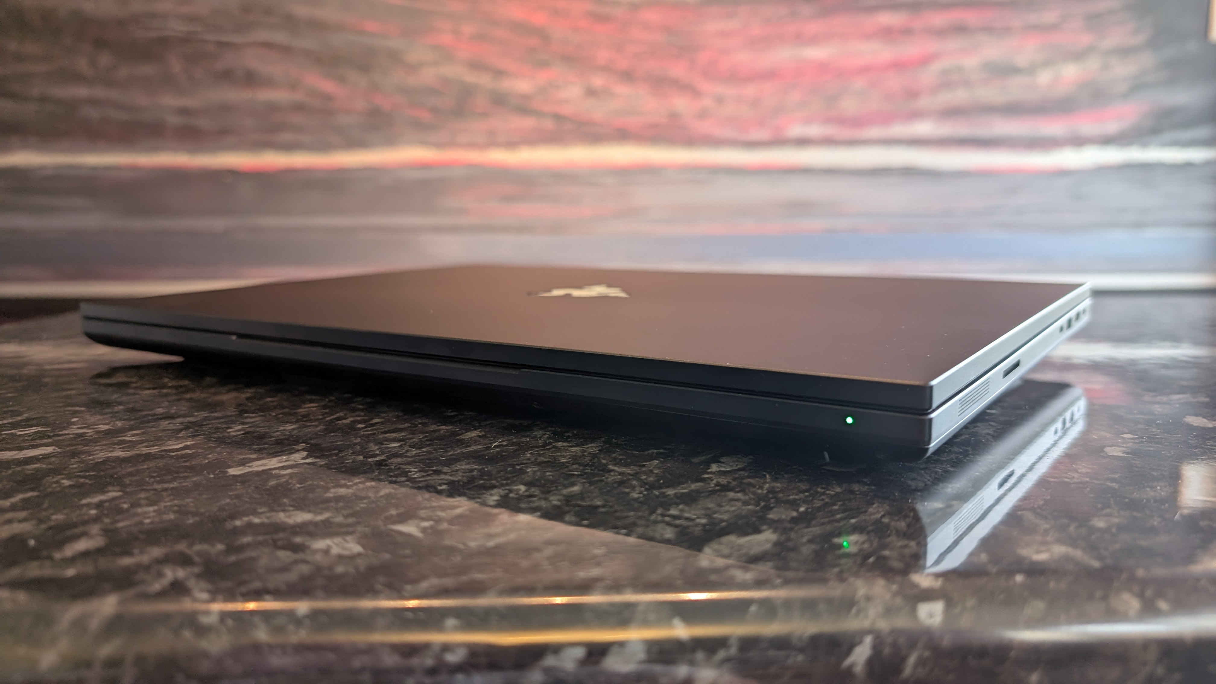 The Razer Blade 18 (2026) pictured on a black marble worktop.