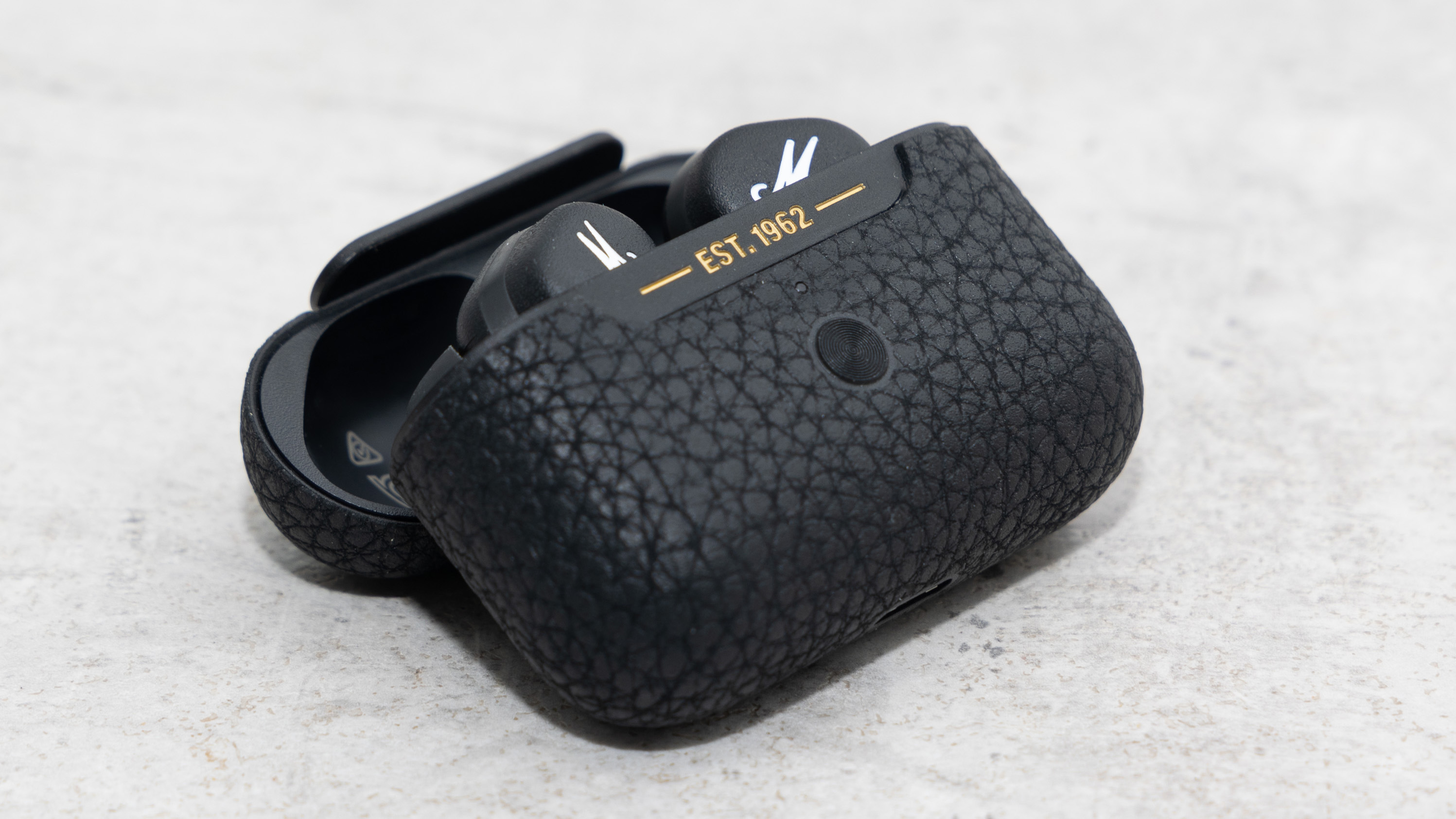 the marshall motif anc true wireless earbuds in their charging case