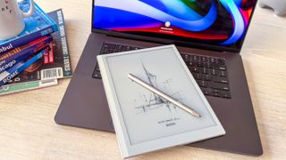 Boox Go 10.3 (Gen II) Lumi and its InkSense Plus stylus lying on a laptop