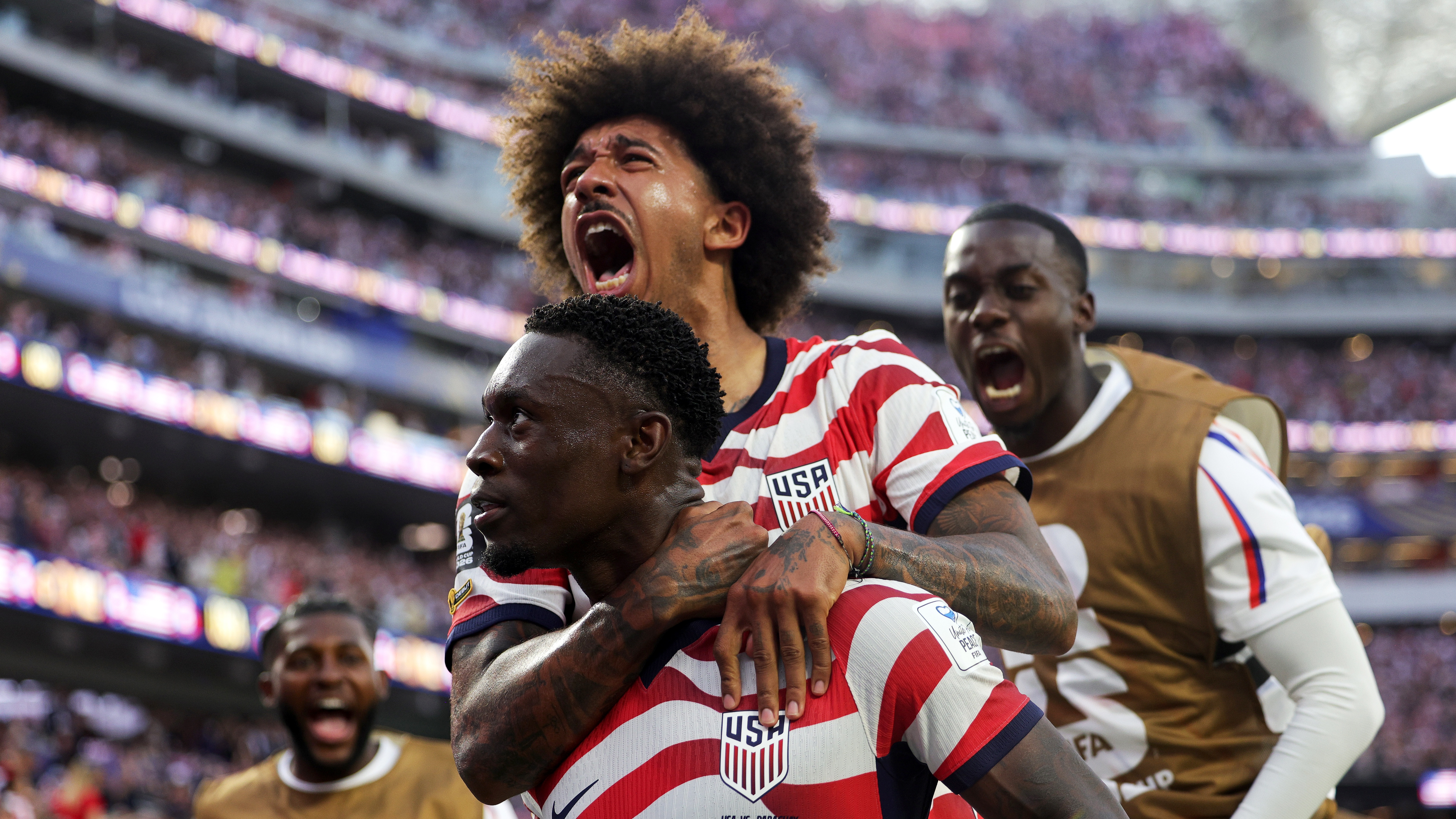 Folarin Balogun of the United States celebrates scoring his team's third goal with Chris Richards during the FIFA World Cup 2026 Group D match against Paraguay at Los Angeles Stadium on June 12, 2026