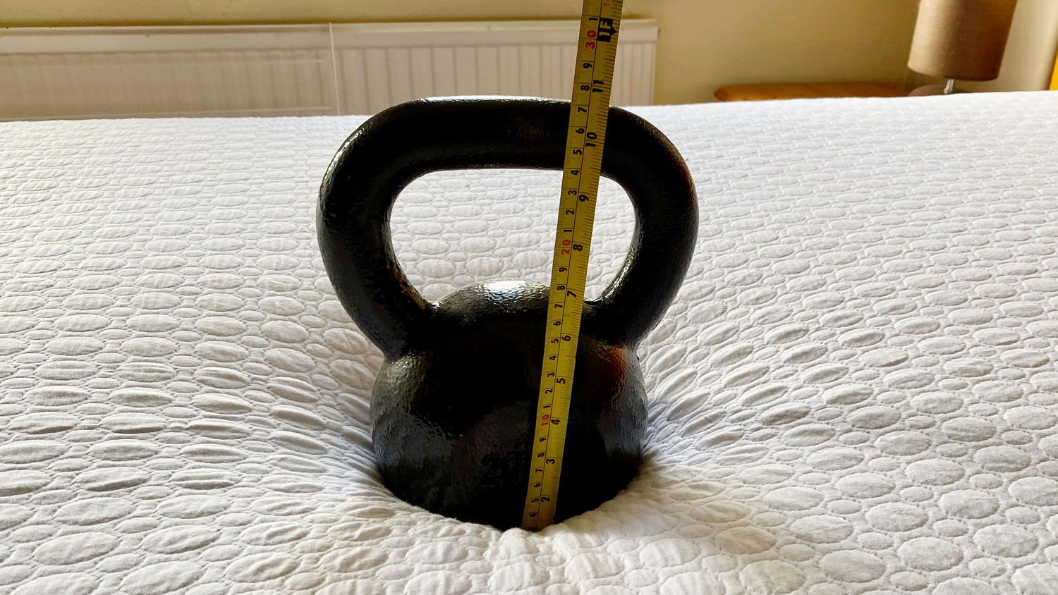 A weight on a Simba GO Hybrid mattress