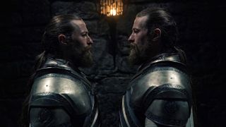 Arryk and Erryk Cargyll stand close face to face in a hallway in House of the Dragon season 2 episode 2