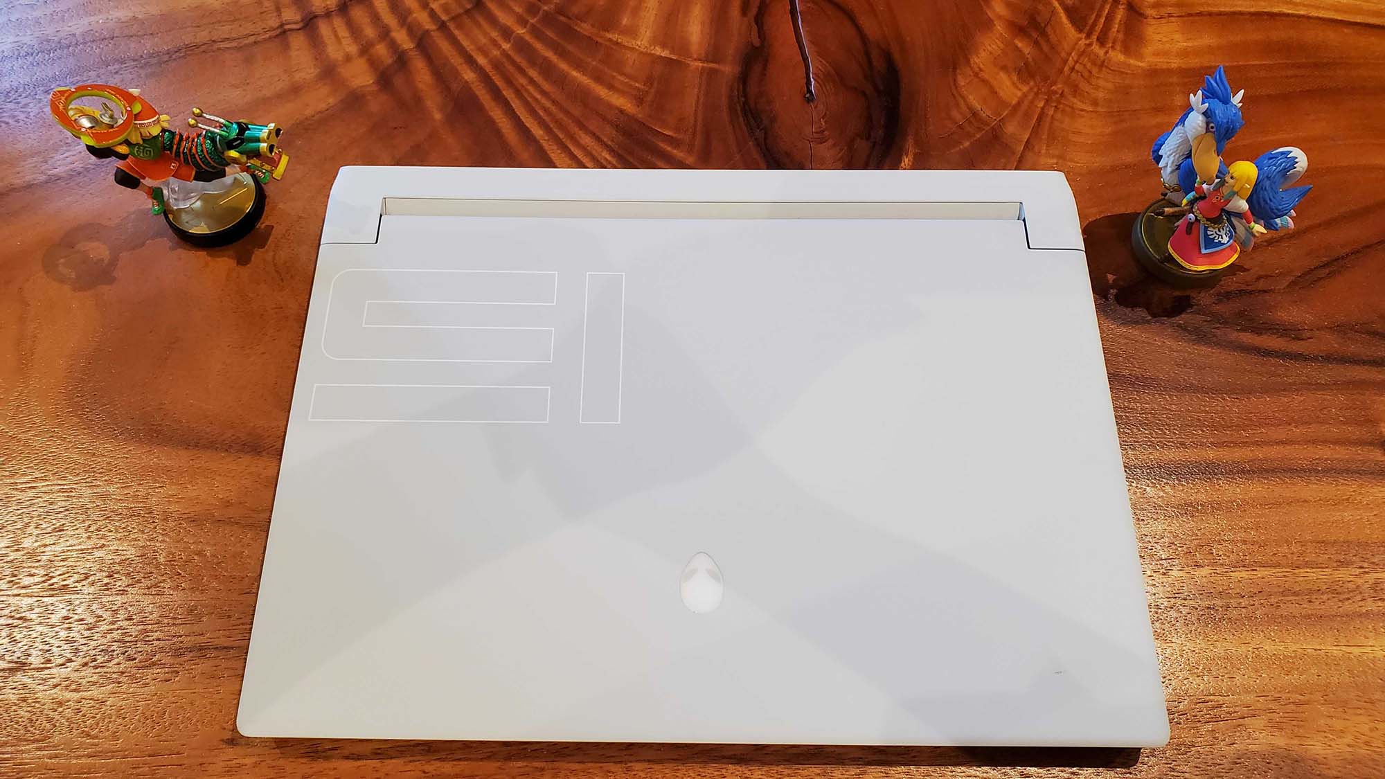 An Alienware x15 R2 gaming laptop on a wooden table
