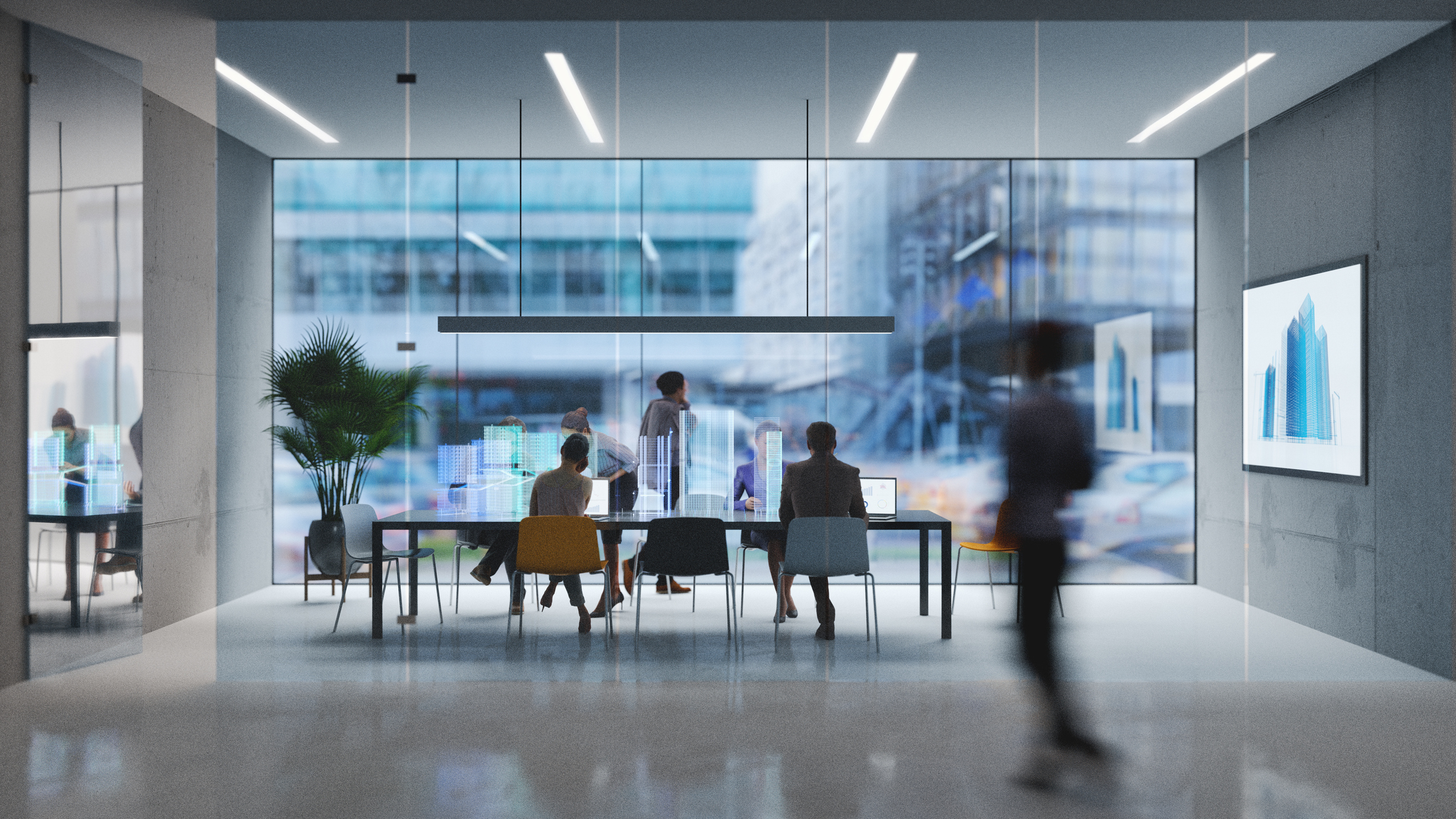 Workers gather around a desk in a futuristic office