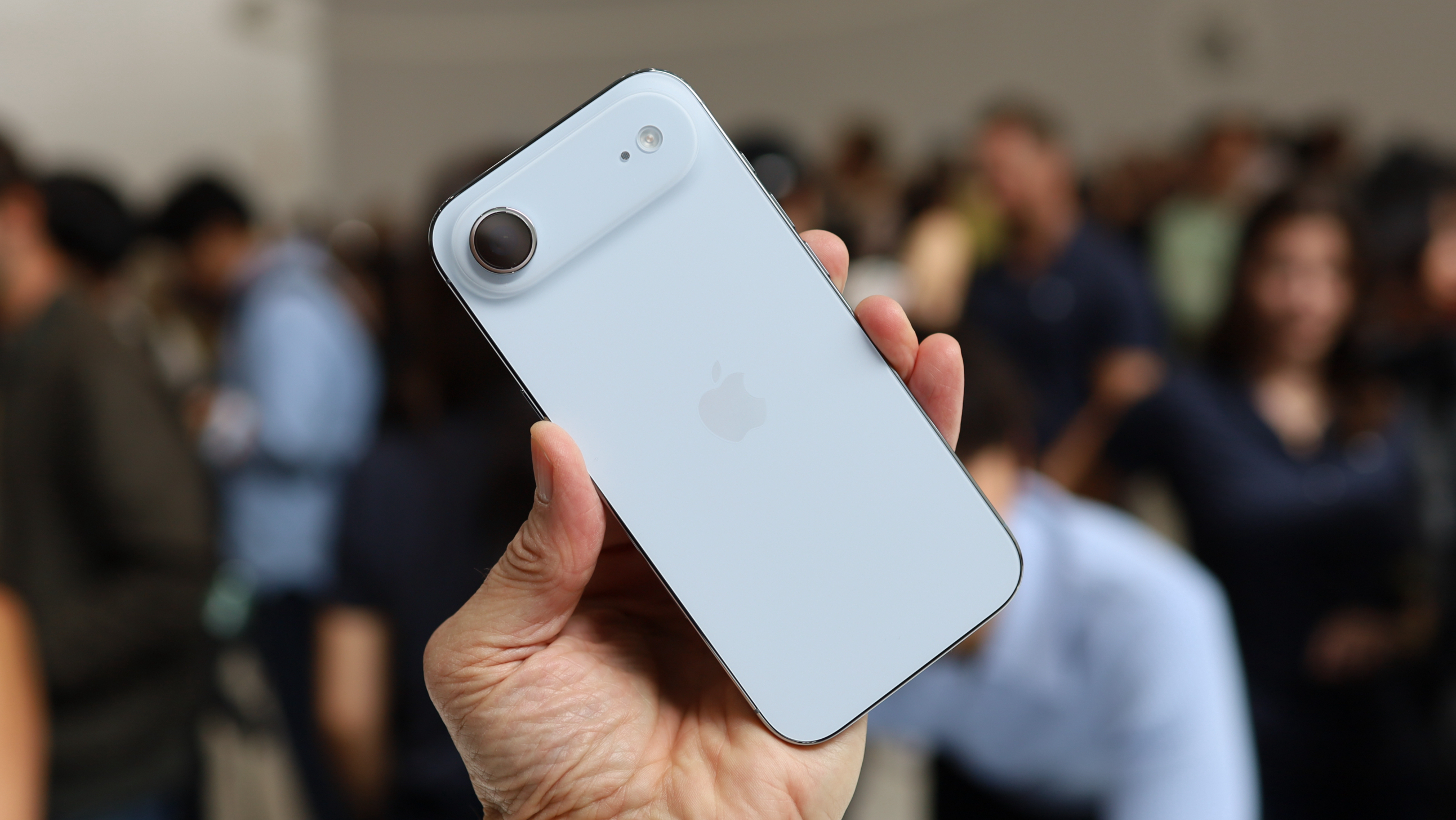 The iPhone Air being held in the hand