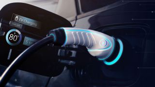A close up of an electric car charger plugged into a vehicle