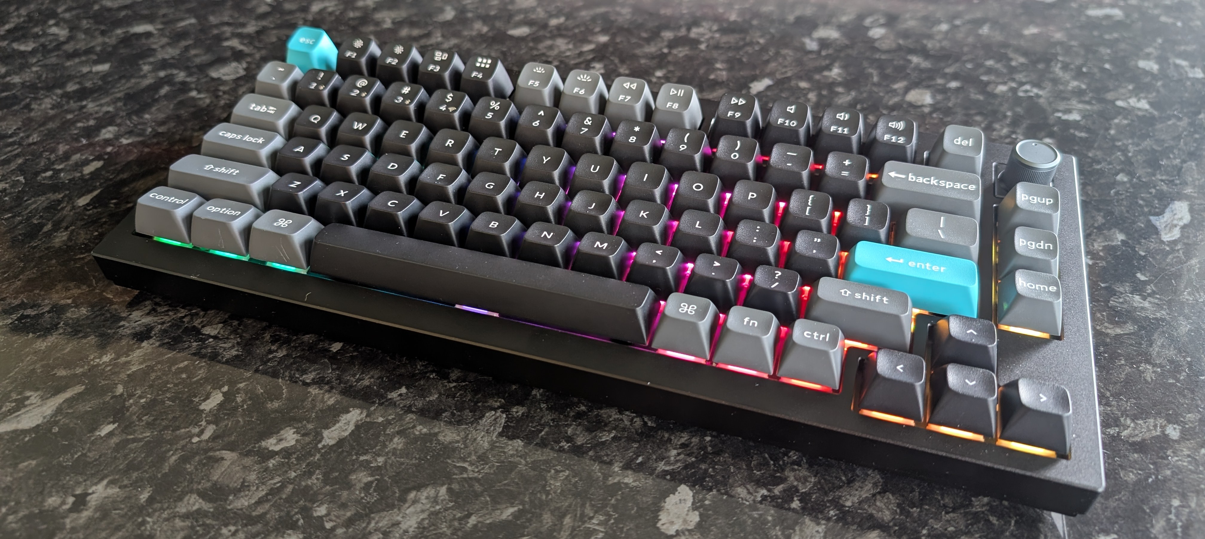 The Keychron Q1 Ultra 8K keyboard photographed on a dark marble worktop.