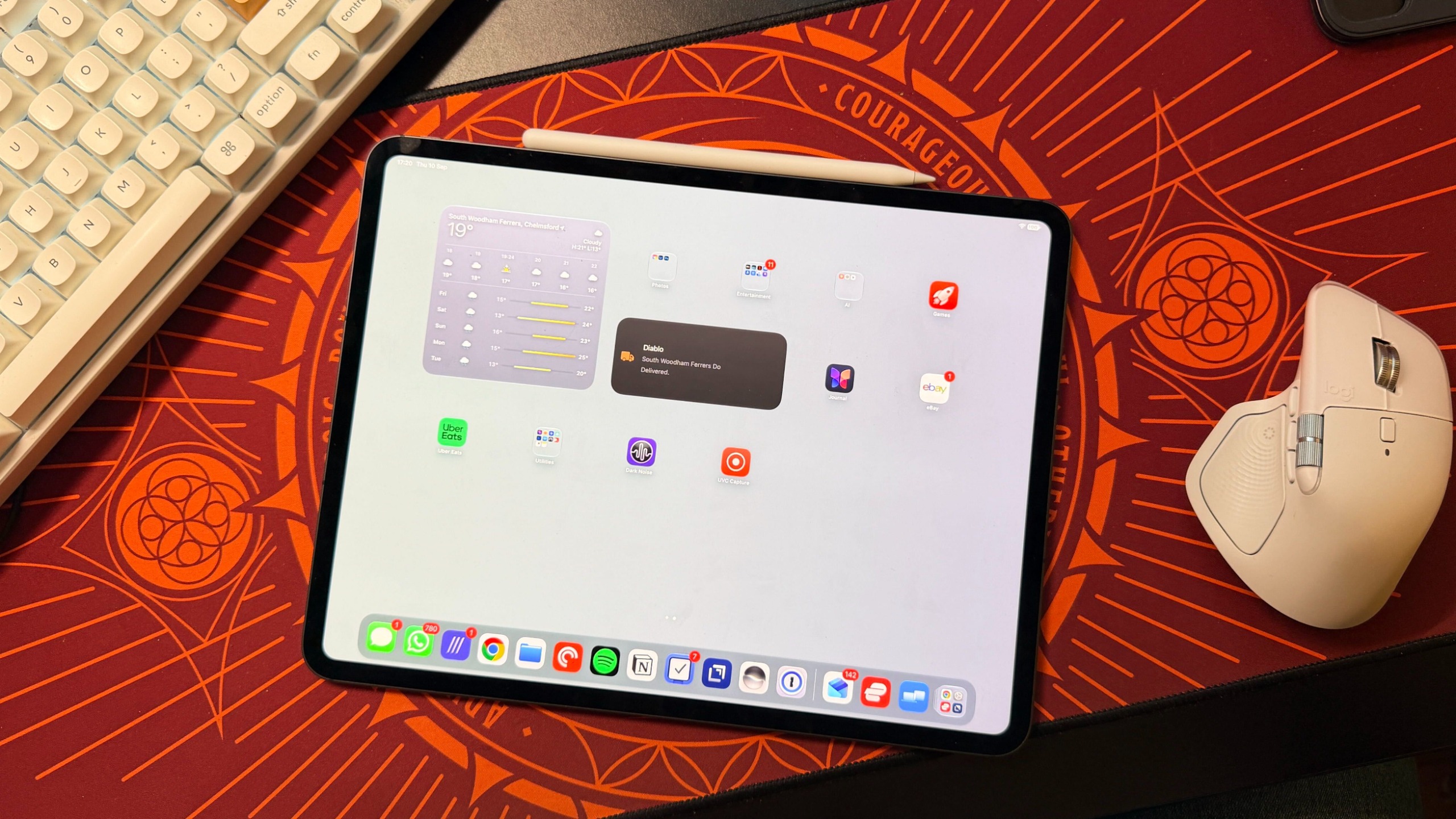 An iPad displaying iPadOS 27 laying on a desk