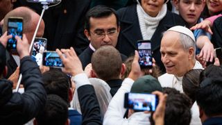 Pope Leo amongst phones