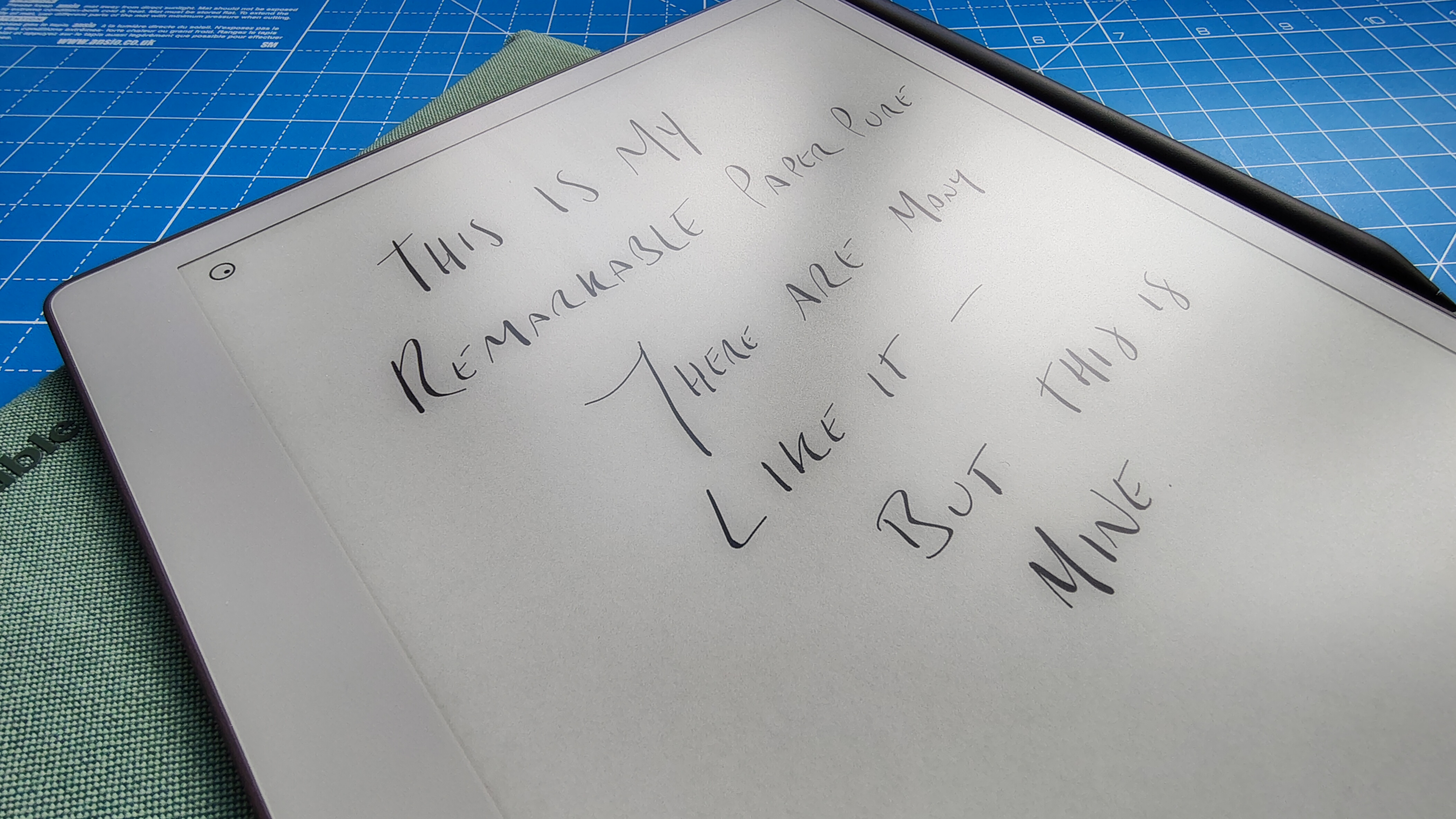 A reMarkable Paper Pure against a blue grid mat during our review process
