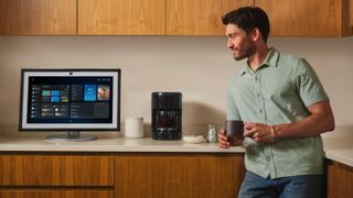 Man speaking to Alexa+ on Amazon Echo Show device