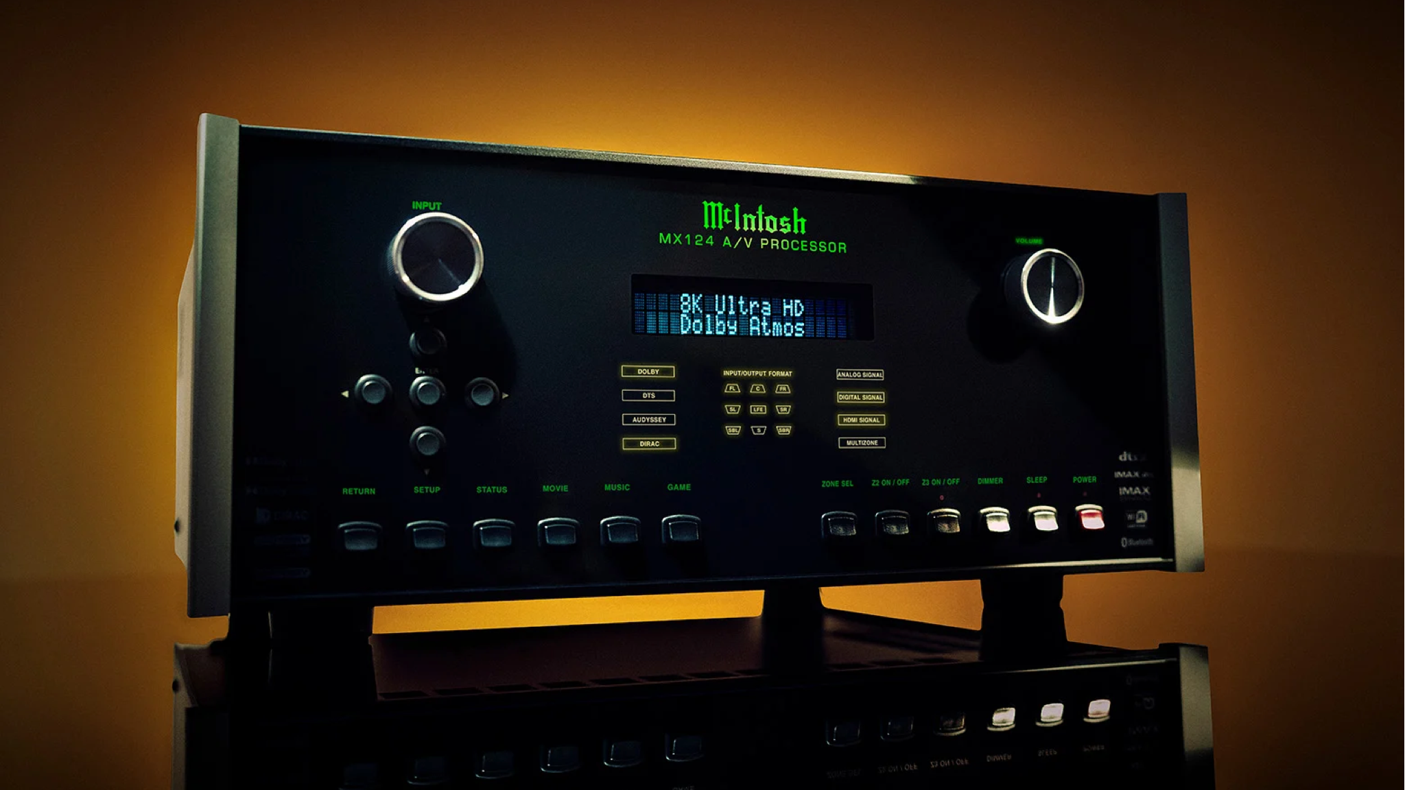 Promotional photo of the McIntosh MX124 A/V Processor with an amber-colored light behind it