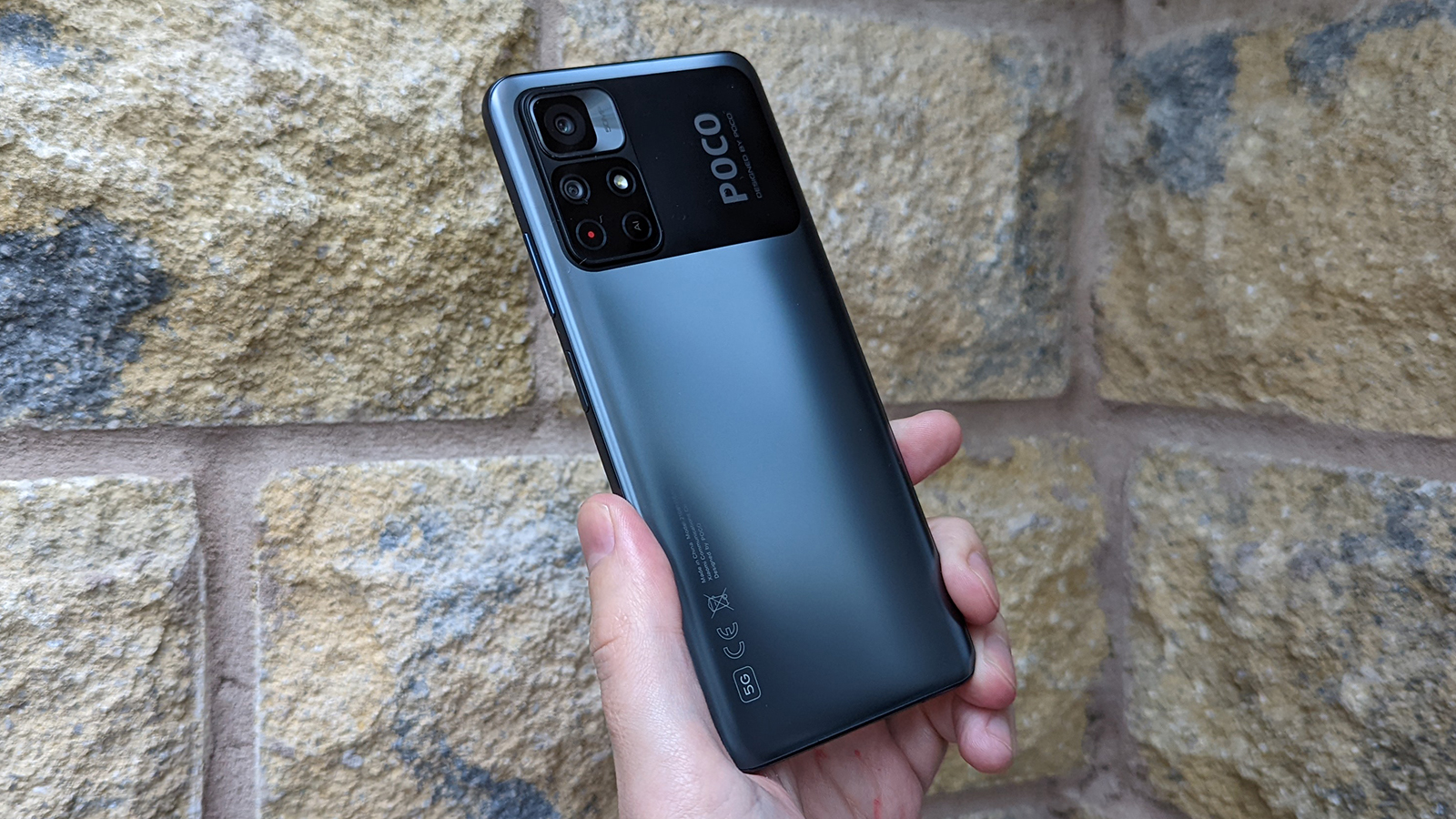 Xiaomi Poco M4 Pro 5G back, being held up.