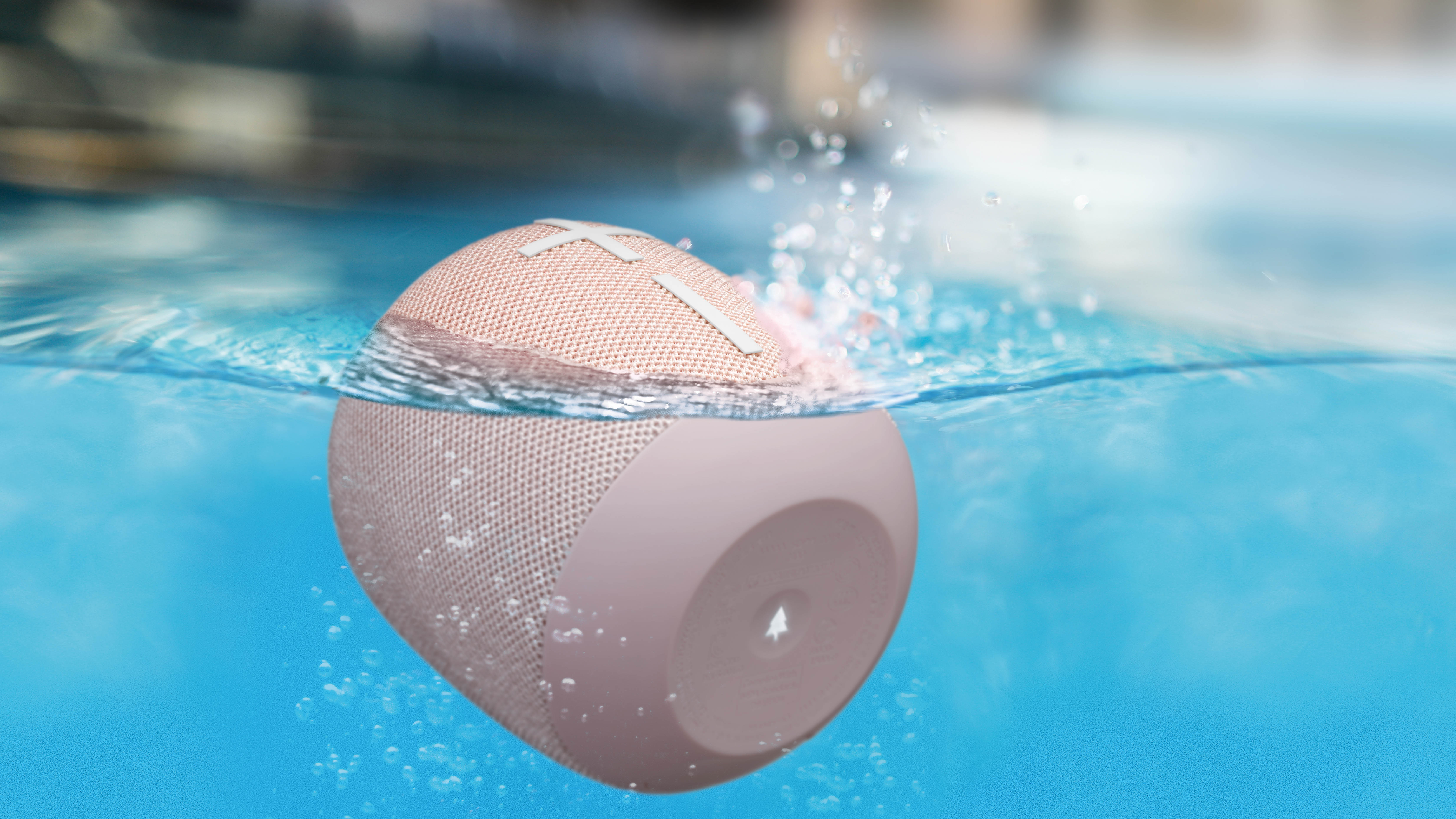 the Ultimate Ears wonderboom 2 bluetooth speaker floating in a pool