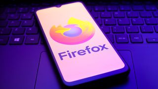 The Mozilla Firefox logo appears on the screen of a smartphone