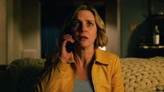 Carol on the phone while looking teary-eyed in Pluribus episode 1