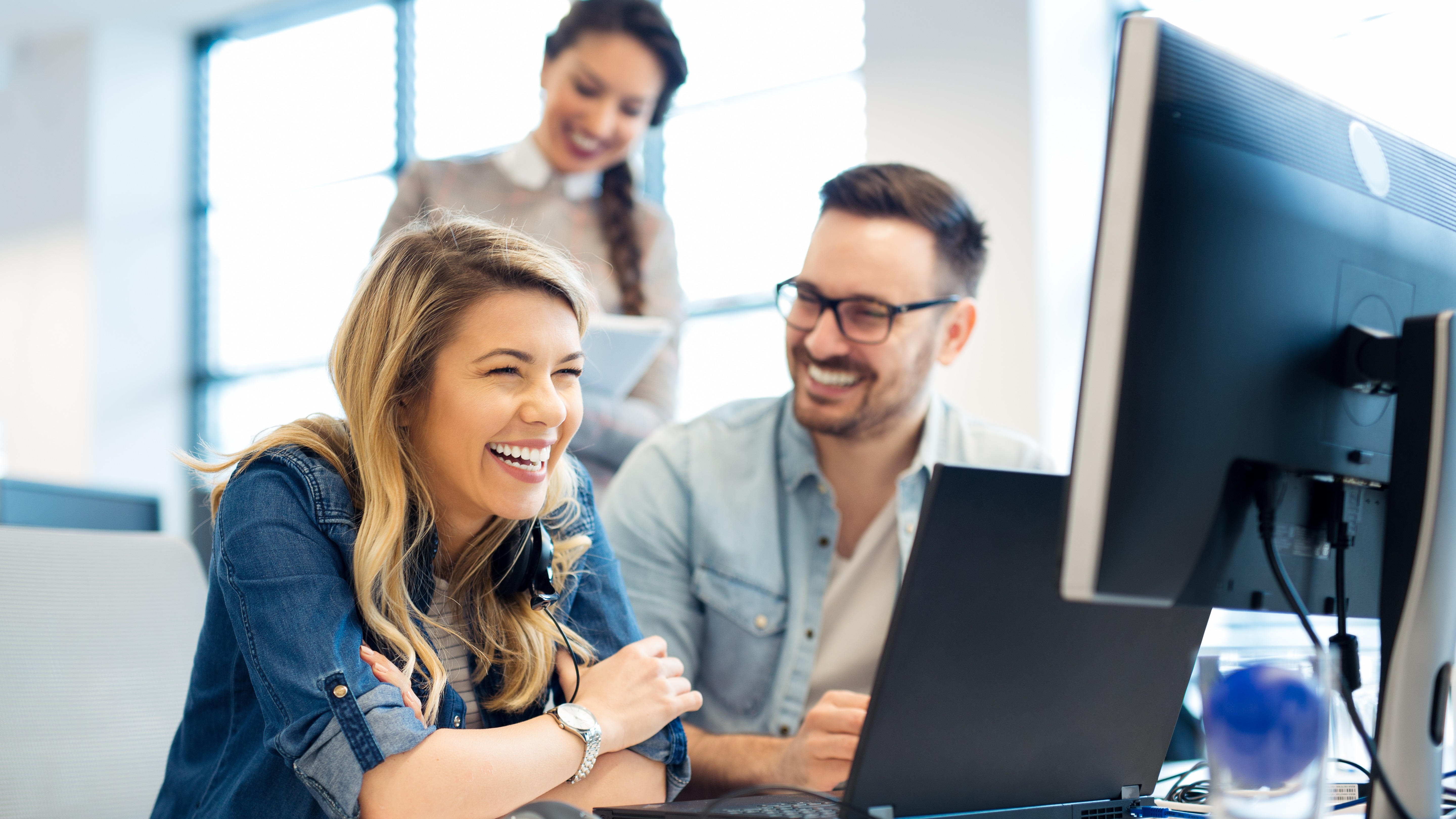 Group of business people and software developers working as a team in office