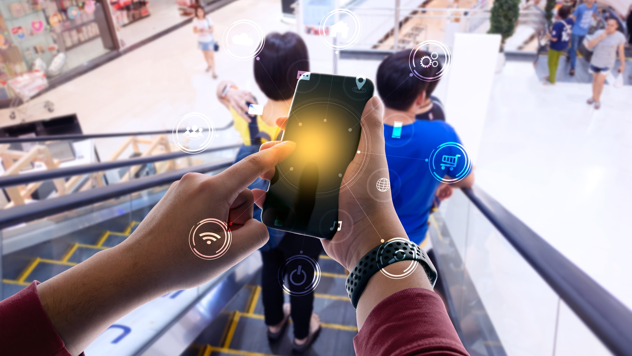 Woman using mobile payment app on escalator