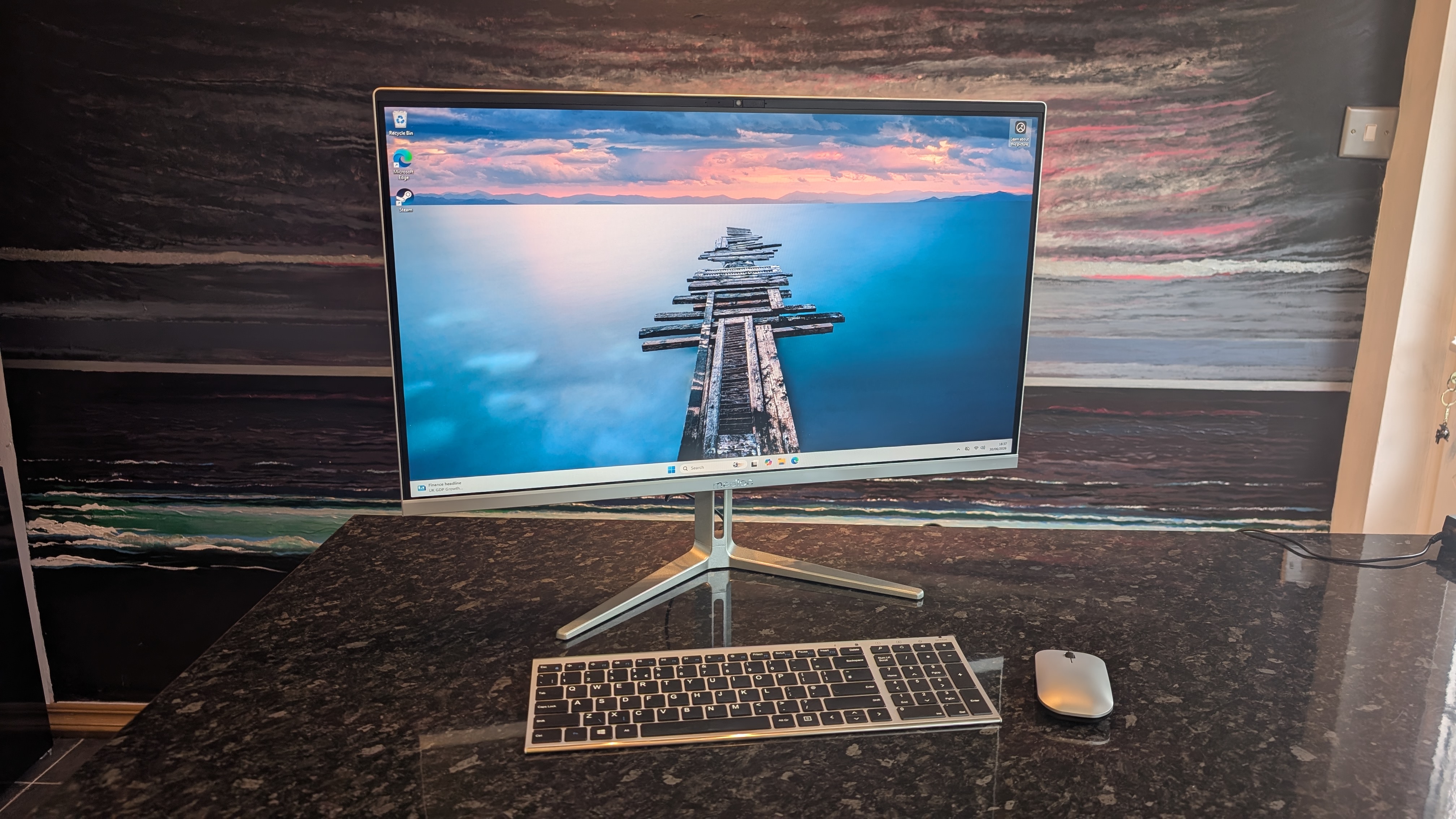 The Medion Signium 27 S1 AIO desktop pictured on a marble worksurface.