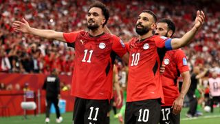 Mohamed Salah #10 of Egypt celebrates with Mostafa Zico #11 after scoring the team's second goal during the FIFA World Cup 2026 Group G match between New Zealand and Egypt