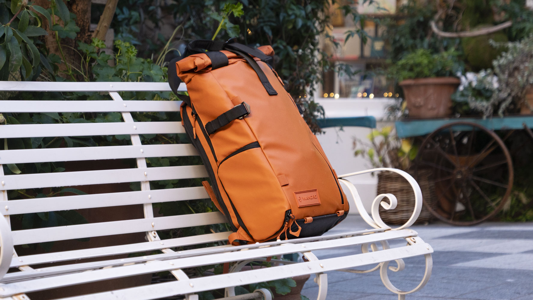 Wandrd PRVKE V4 bag on a white metal bench