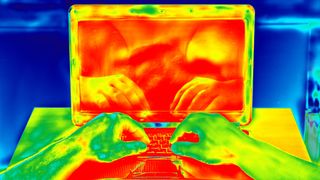 thermal view of human using laptop