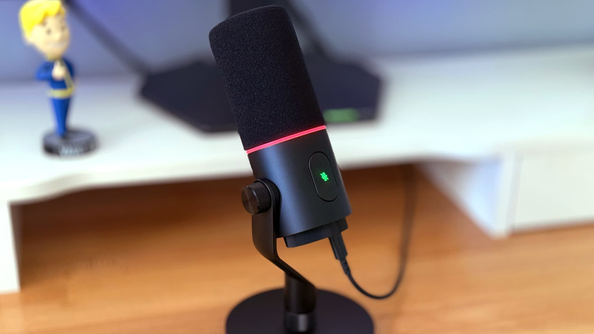 Razer Seiren V3 Pro microphone on wooden desk
