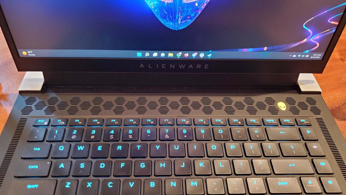 An Alienware x15 R2 gaming laptop on a wooden table