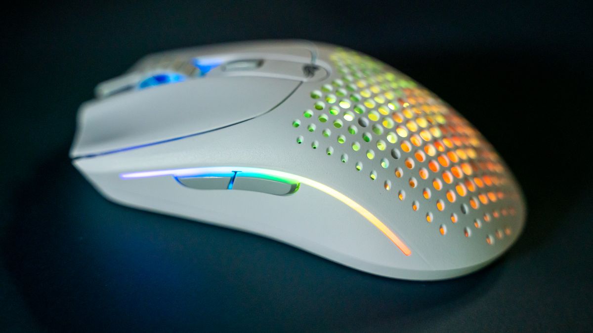 Glorious O2 Wireless on a dark blue desk pad