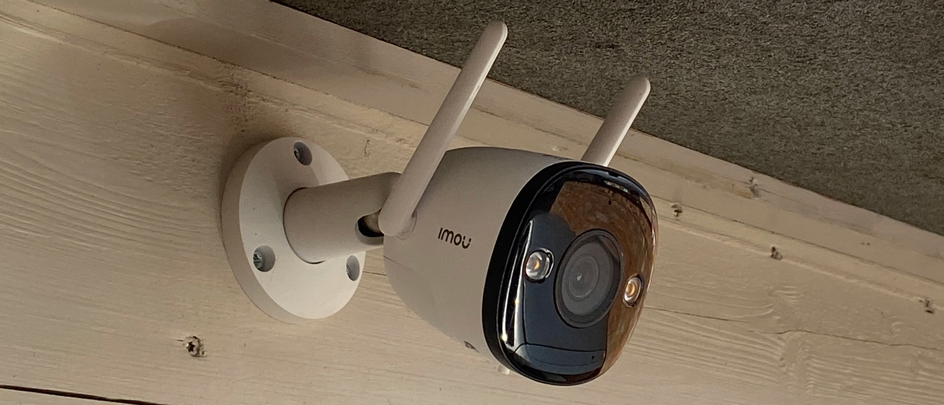 The side view of the Imou Bullet 2 mounted on a property