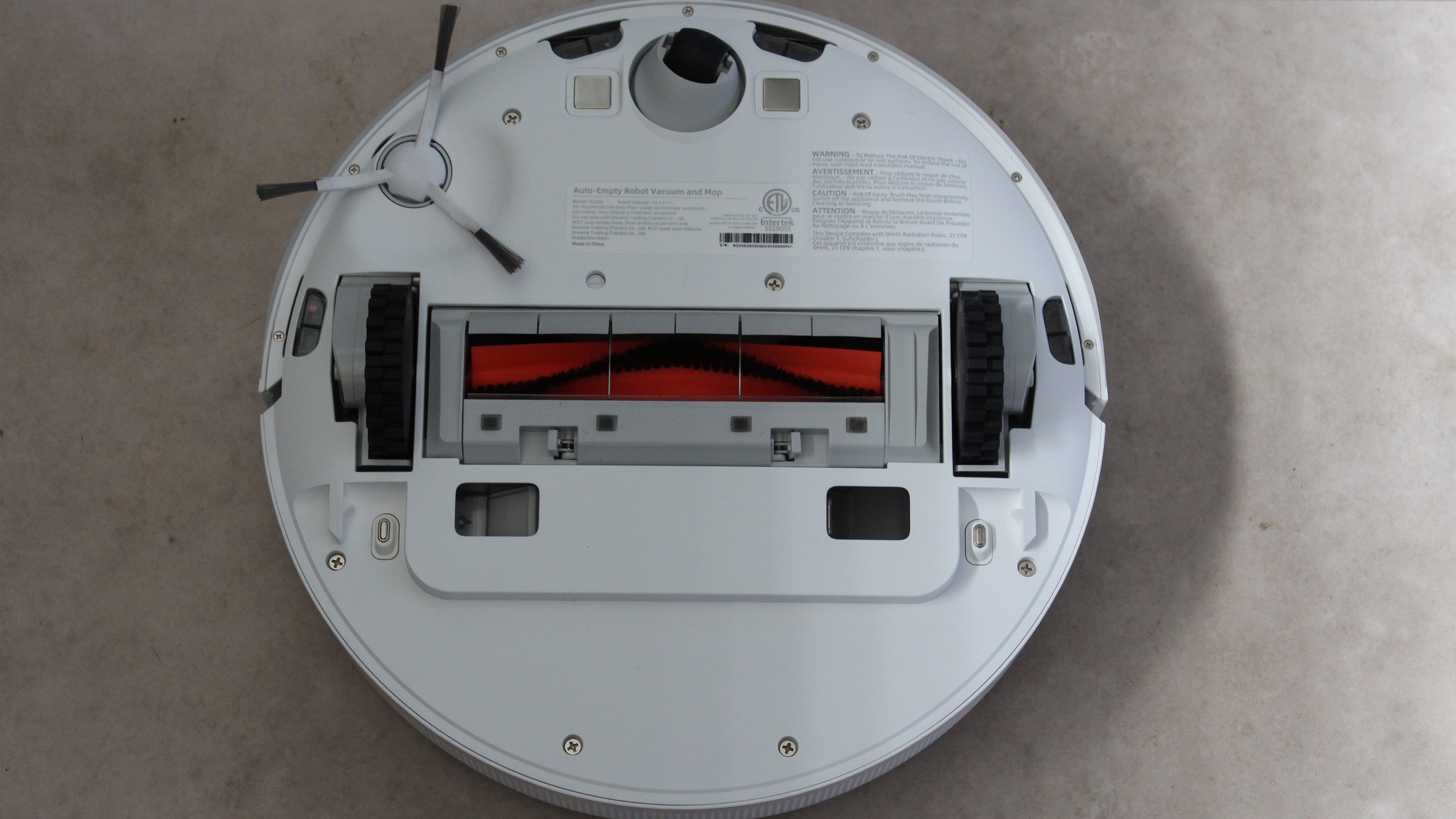 DreameBot D10 Plus underneath showing main brush, side brush