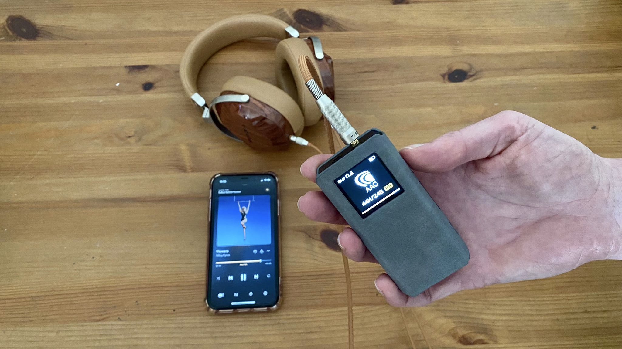 Fiio BTR7 next to an iPhone and Sivga Oriole headphones
