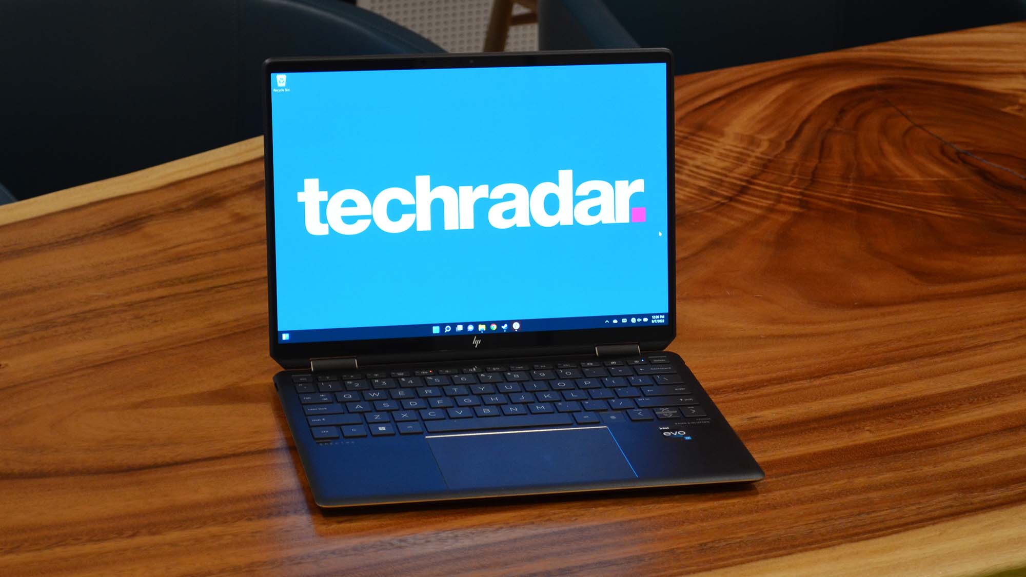 An HP Spectre x360 2022 on a wooden table