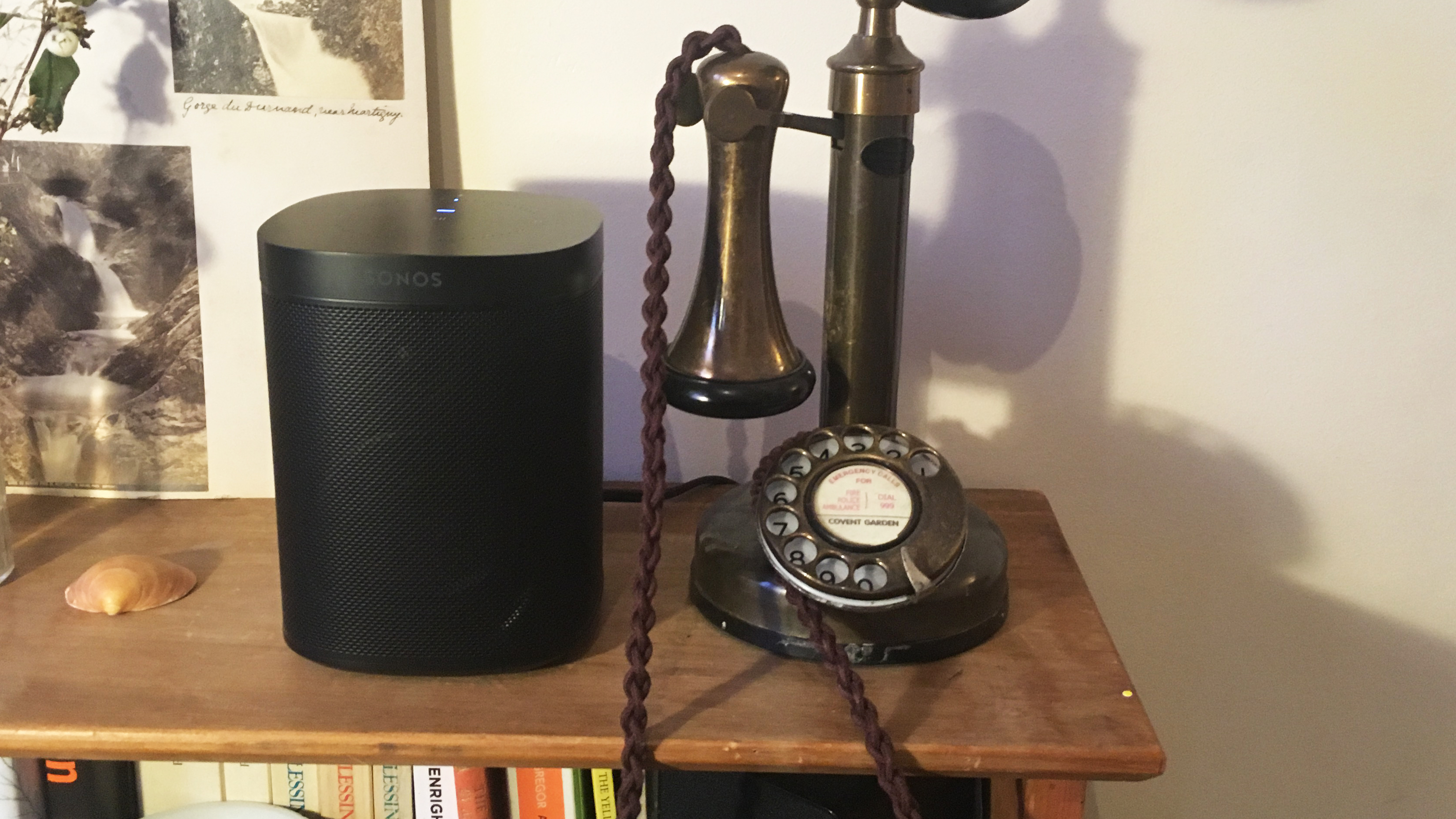 The Sonos One in black on a shelf