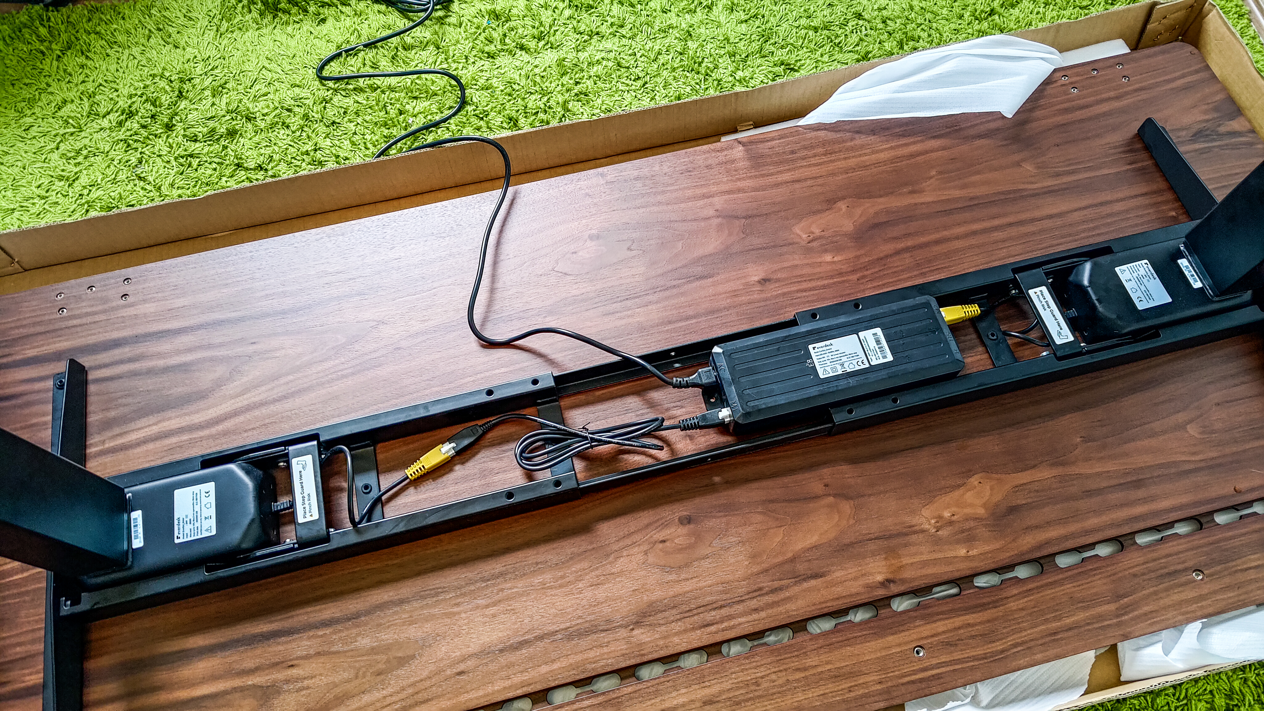 The electric motor attached to the EverDesk Max table top