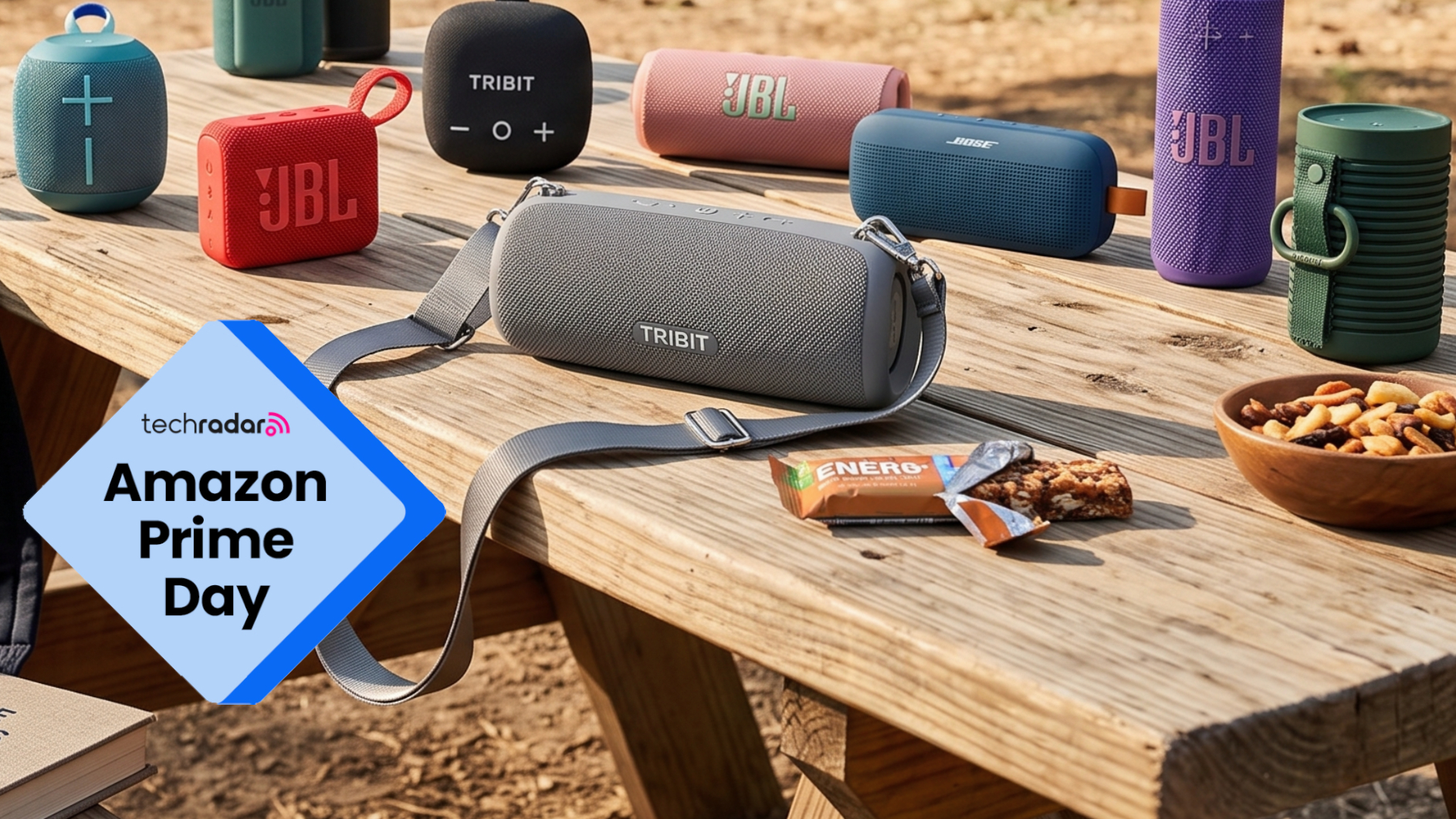 A selection of Bluetooth speakers, on a picnic table