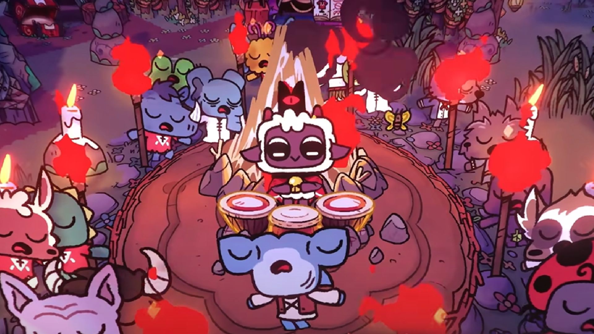 The lamb plays a drum, as followers dance around in a circle holding torches