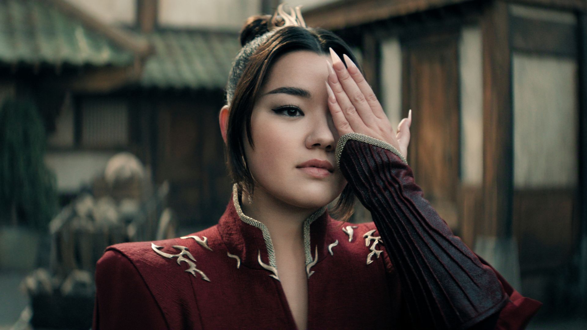 Azula covers her eye with one hand