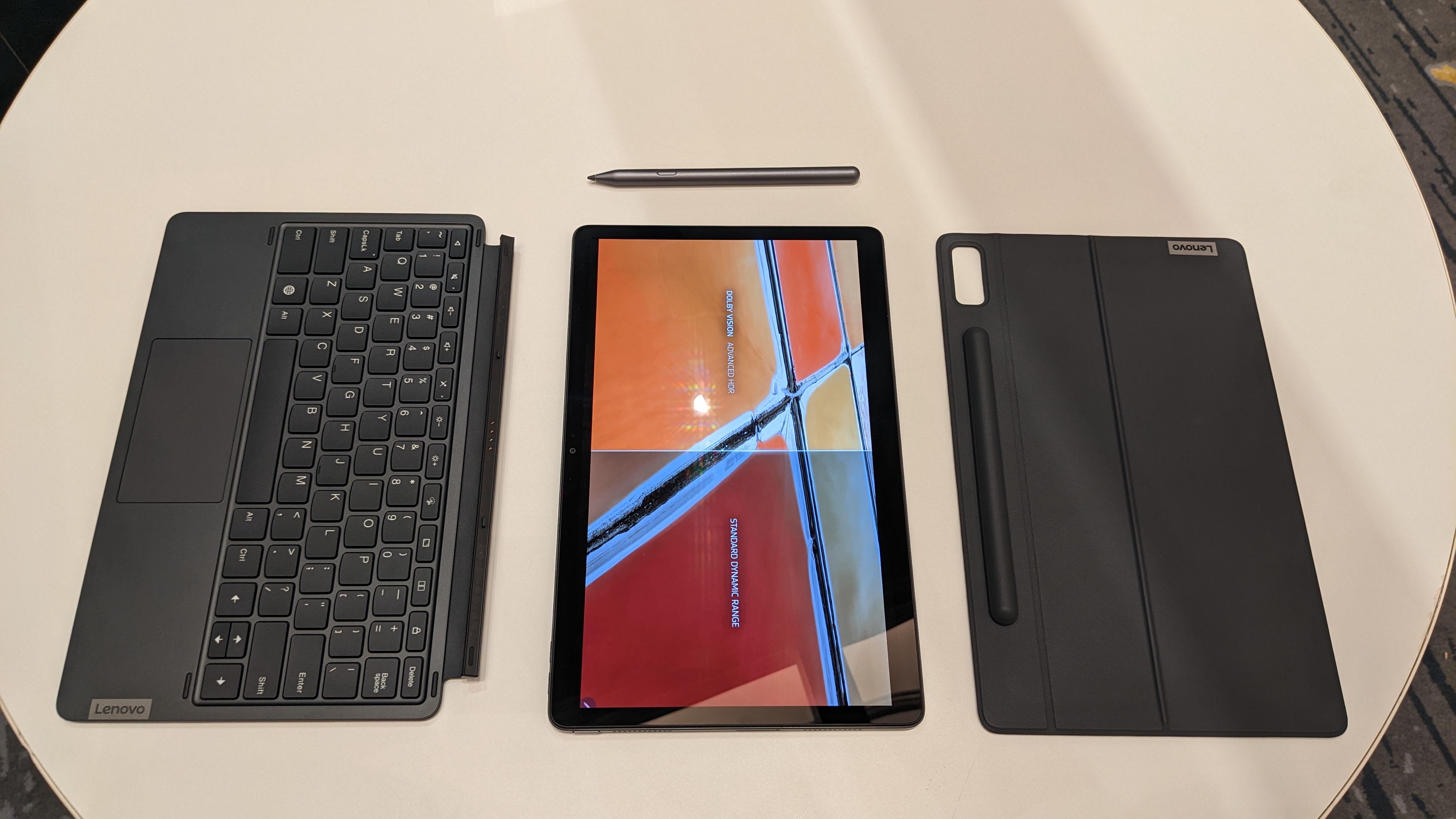 Lenovo Tab P11 Pro Gen 2 on a round wooden table.