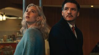 Sue Storm and Reed Richards looking worried as they stare at the sky in The Fantastic Four: First Steps