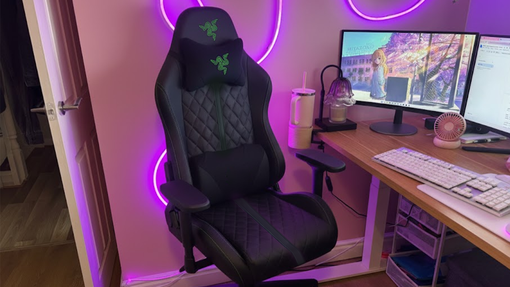 The Razer Enki Pro gaming chair in a colorful gaming and office set-up.