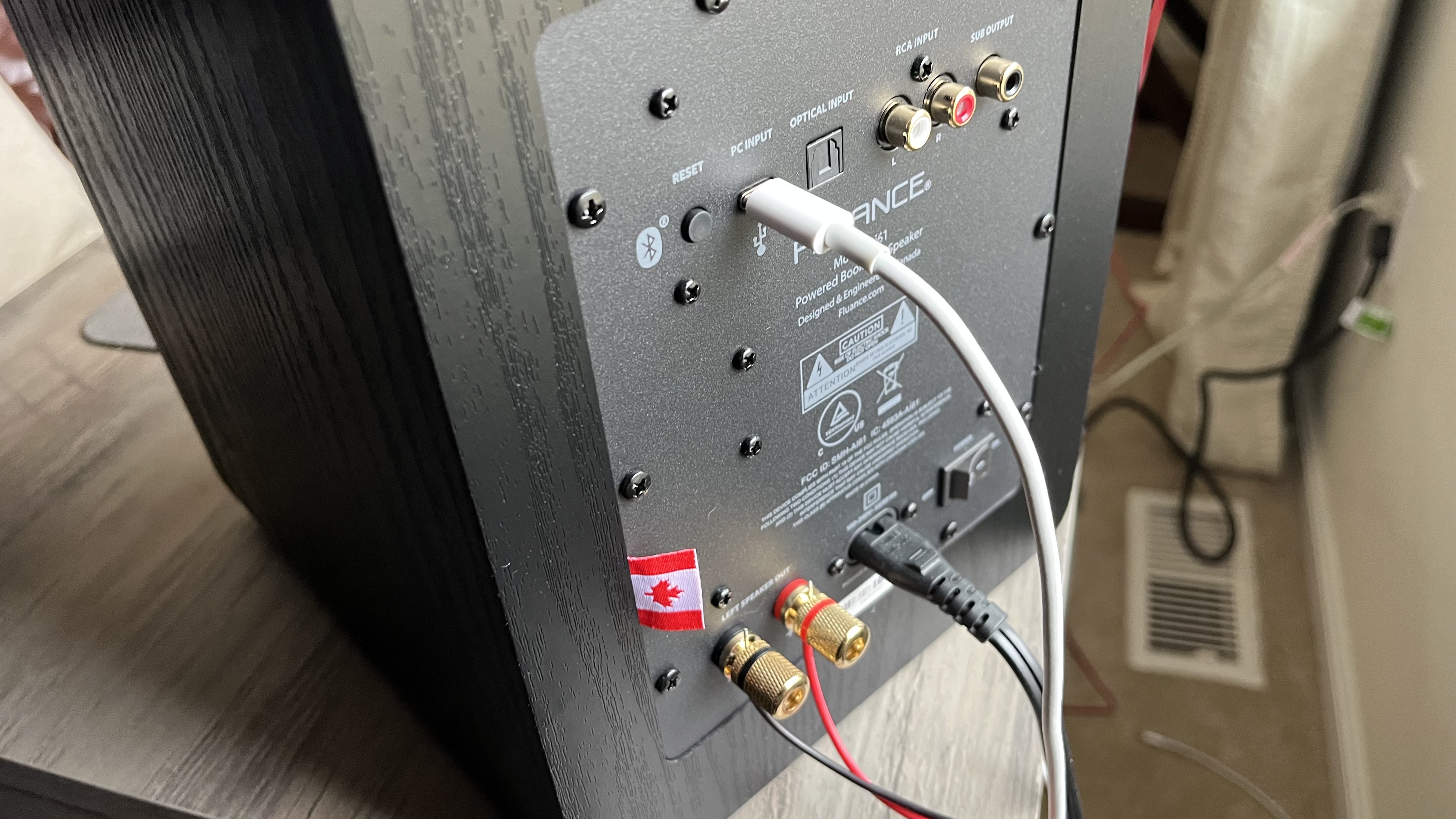 Fluance Ai61 stereo speaker rear panel showing connectivity options