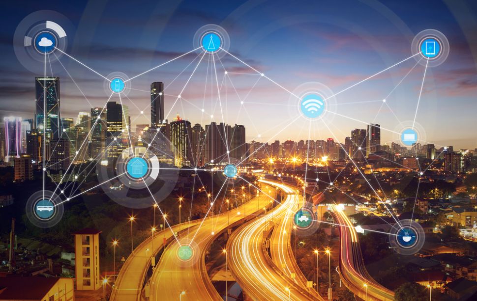 Depiction of a smart city with a network of digital symbols overlaid