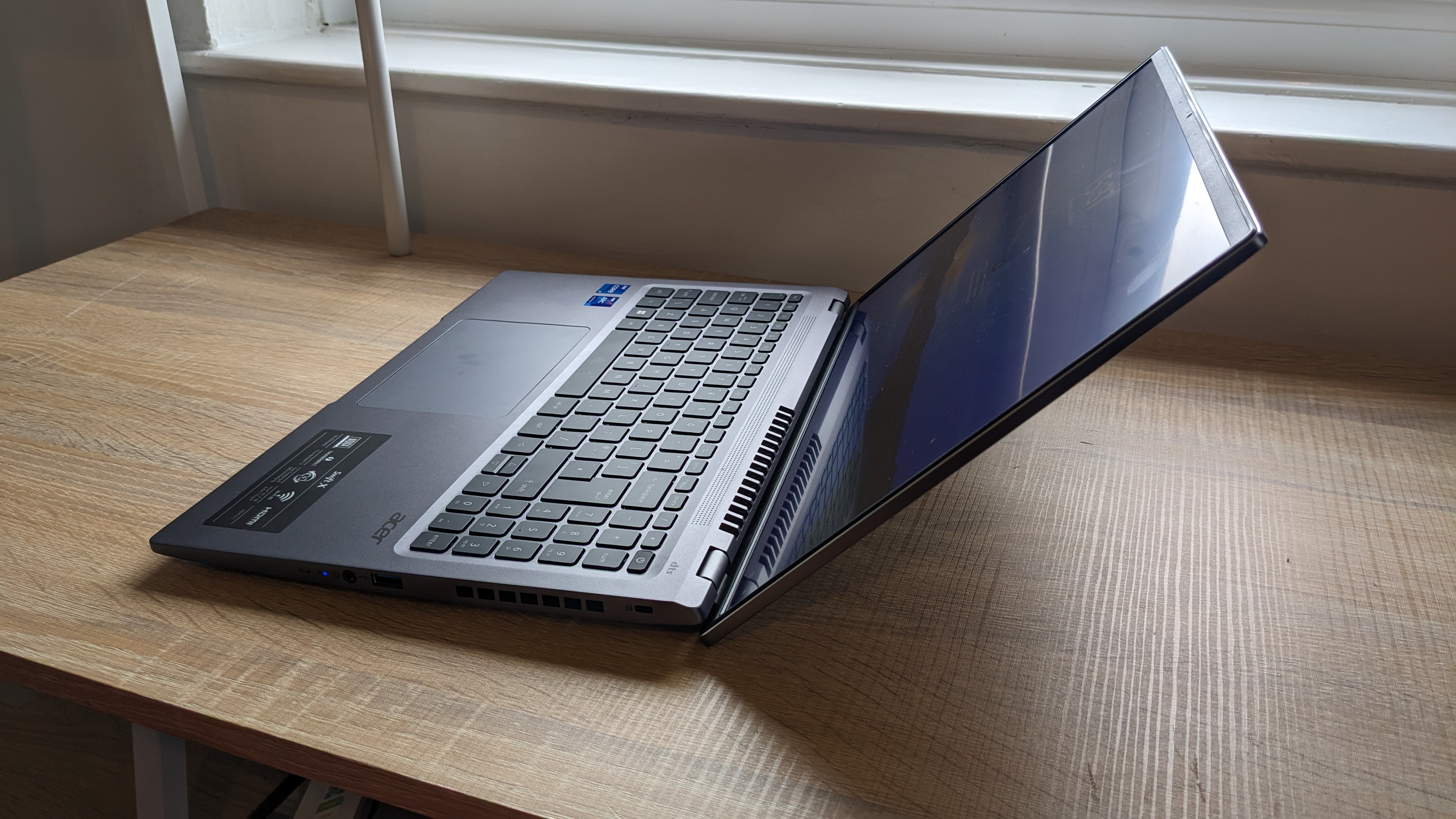 Acer Swift X 16 on wooden table