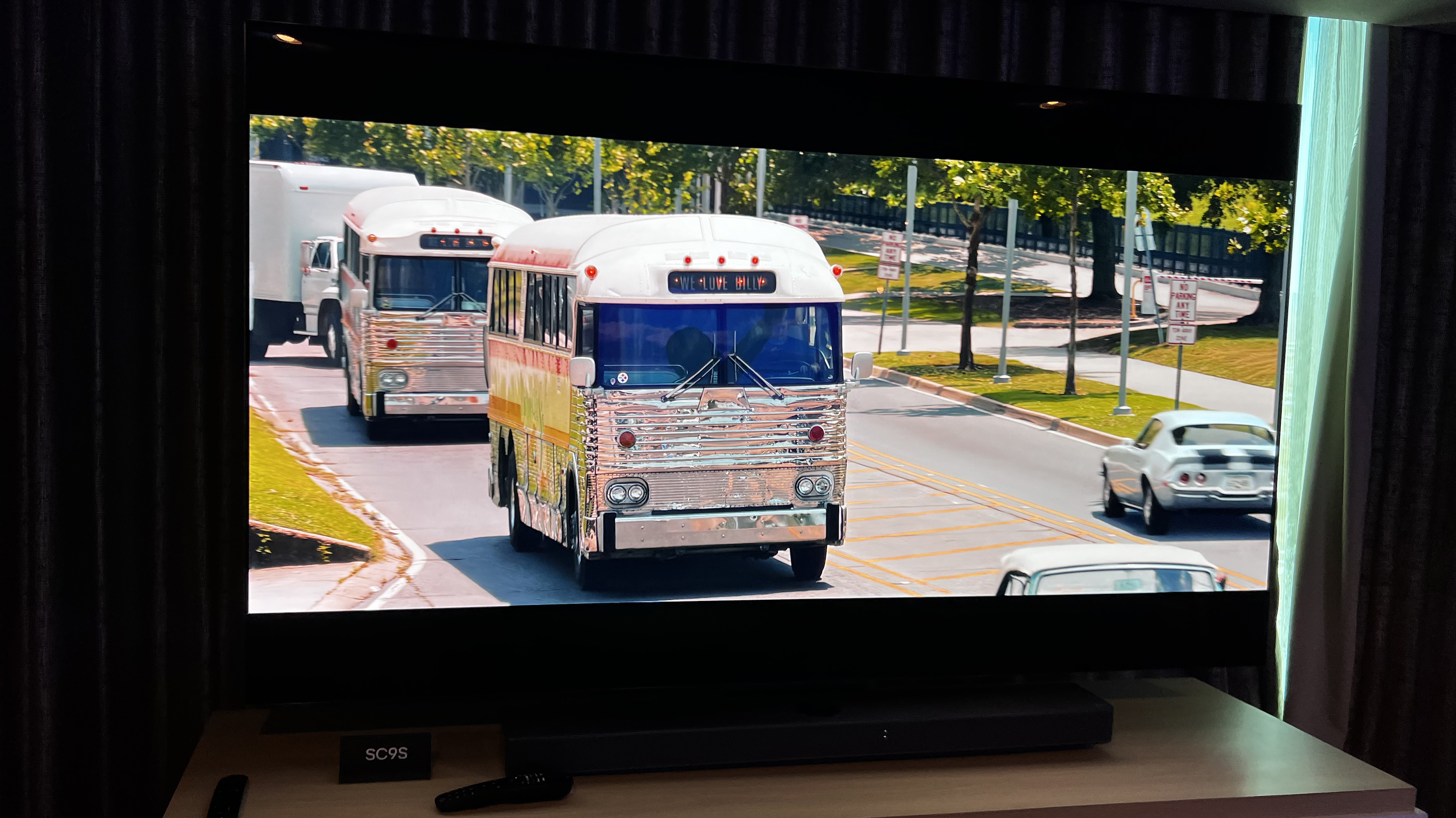 The LG C4 TV in a hotel room, demoing a movie