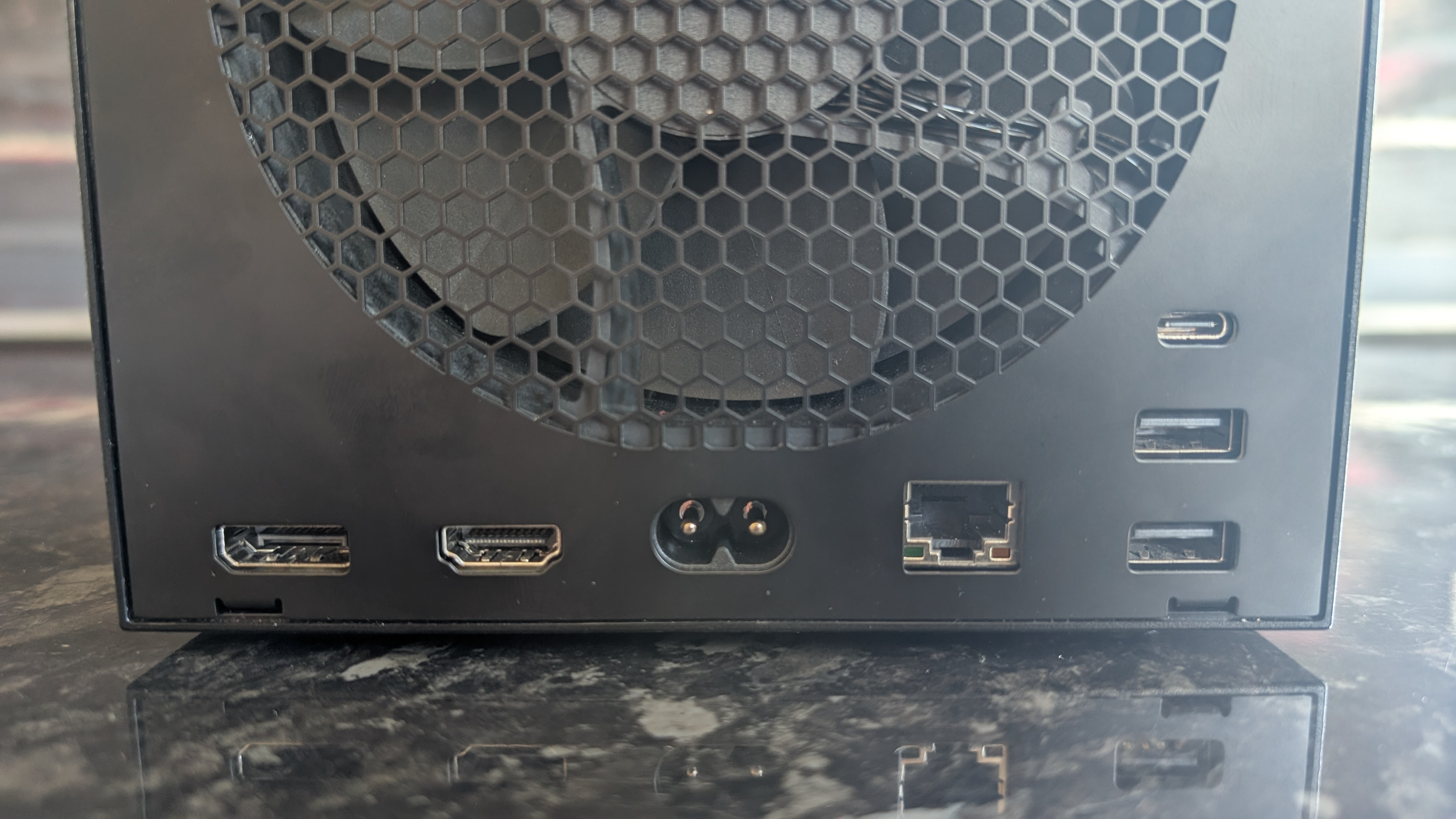 The Valve Steam Machine, pictured on a dark marble worktop.