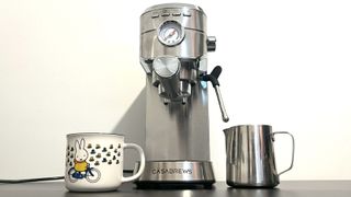 Casabrews CM5418 on kitchen counter with mug and milk jog
